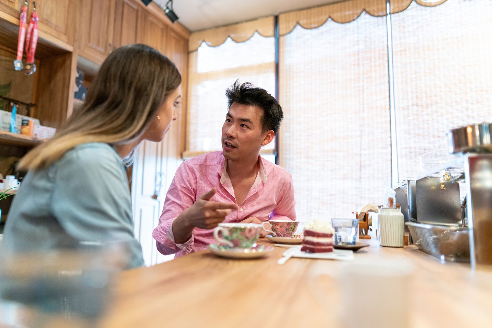 Young couple having conversation in cafe